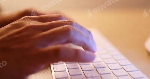 Preview: Typing on laptop computer