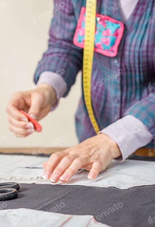 Preview: Dressmaker design tailor pattern on the table