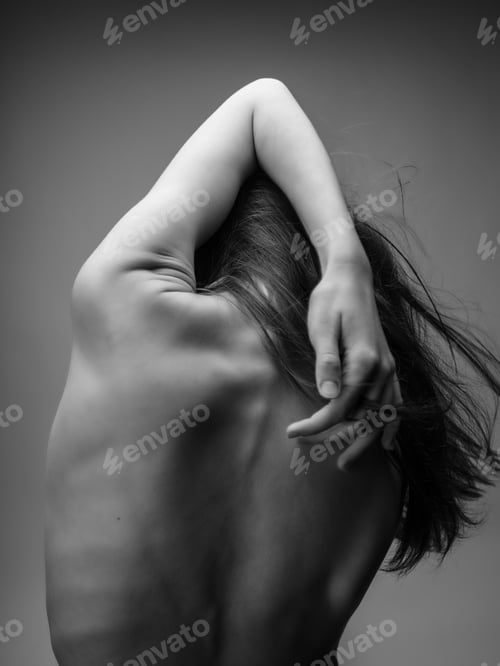 Preview: woman with red hair hands on back back view black and white photo