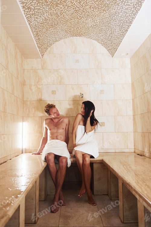 Preview: Happy couple together in sauna. Conception of vacation and weekend
