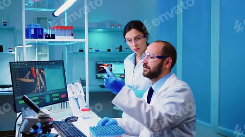 Preview: Chemist doctor explaining to nurse vaccine development