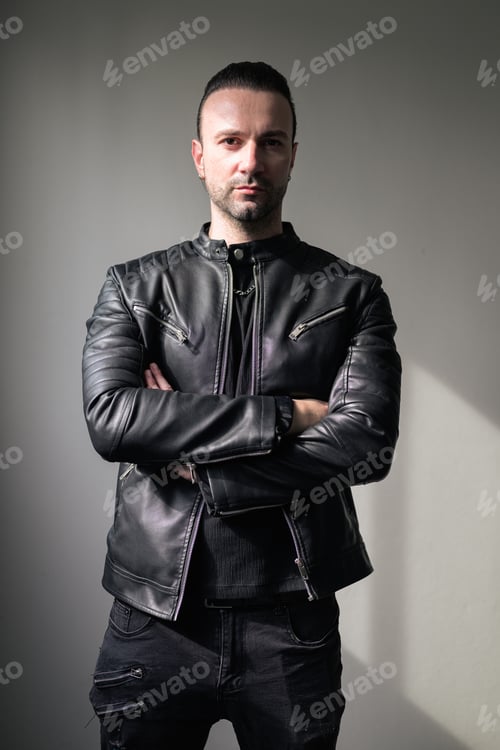 Preview: Man Wearing Leather Jacket with Arms Crossed