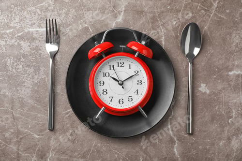 Preview: Flat lay composition with alarm clock, plate and utensils on grey background