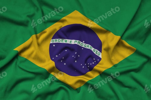 Preview: Brazil flag is depicted on a sports cloth fabric with many folds. Sport team waving banner