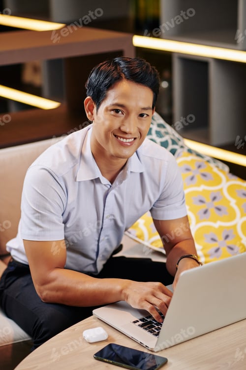 Preview: Young man working on laptop