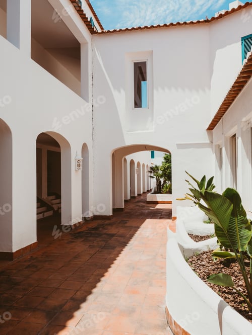 Preview: Cozy exterior or patio of the modern building with white walls, arches, windows