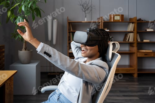 Preview: Amazed african woman in VR headset enjoying shopping in virtual reality during work break in office