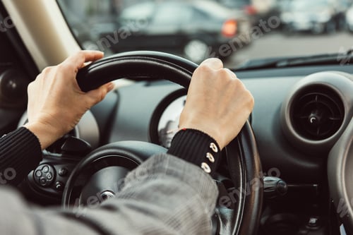 Preview: partial view of adult woman driving car