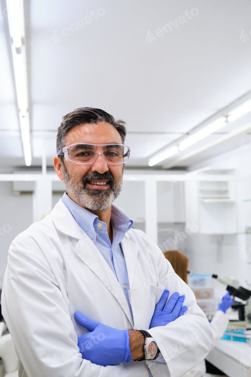 Preview: Middle aged professional researcher smiling and looking at camera.