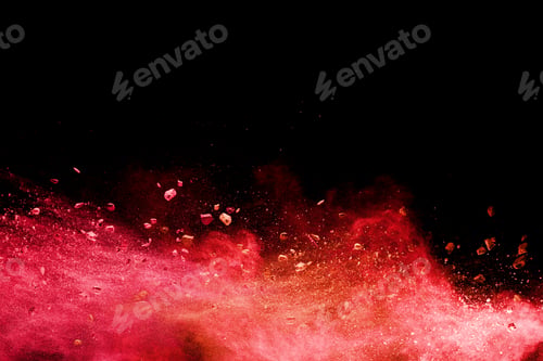 Preview: Split debris of stone exploding with orange powder splash against black background.