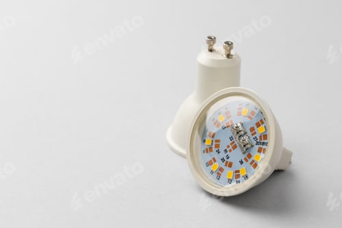 Preview: Light bulb on light grey paper background