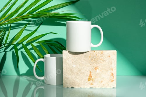 Preview: Porcelain mug and palm leaf against mint background