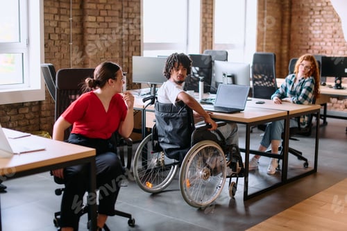 Preview: A diverse group of business professionals collaborates in a modern startup coworking center