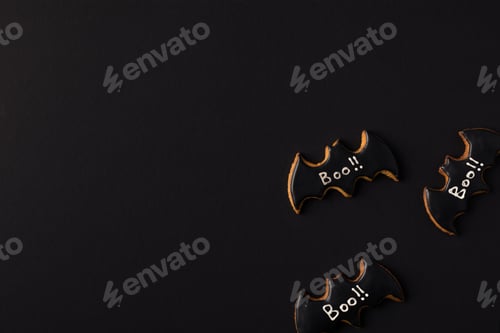 Preview: close-up view of halloween bat cookies isolated on black