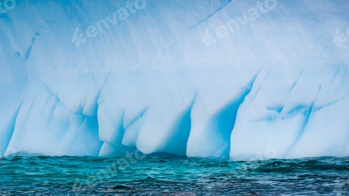 Preview: Closeup of an iceberg in the ocean in the daylight in Antarctica