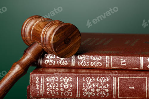 Preview: Close up of a brown wooden gavel and book