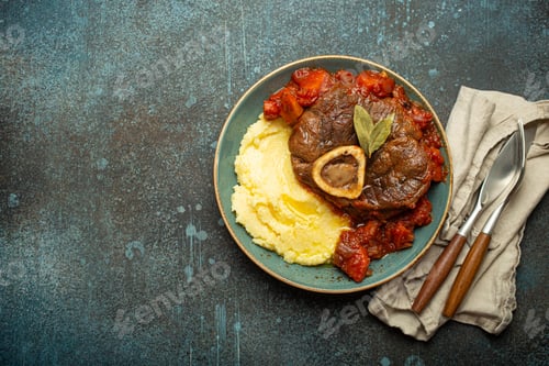 Preview: Traditional Italian dish Ossobuco all Milanese made with cut veal shank meat with vegetable tomato