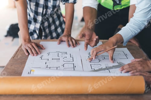 Preview: Engineer or architect plan meeting and draw model of office buildings working together