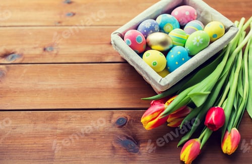 Preview: close up of colored easter eggs and flowers