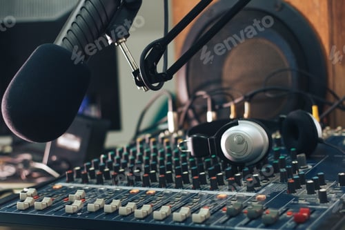 Preview: Radio host microphone, mixing console and headphones close-up
