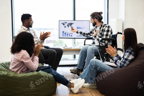 Preview: Diverse team discussing global business analytics during office presentation