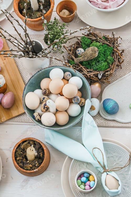 Preview: Table decoration for Easter celebration in kitchen.Tablescape for Easter holiday at home.Family reli