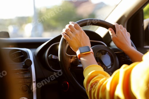 Preview: Woman behind steering wheel of modern car, closeup