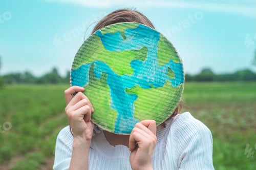 Preview: girl holding drawn planet in hands
