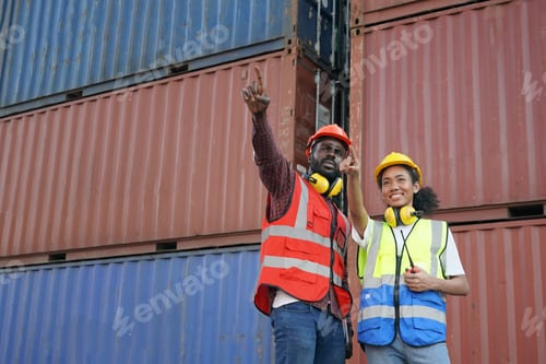 Preview: Foreman control loading Containers box from Cargo freight ship for import export.