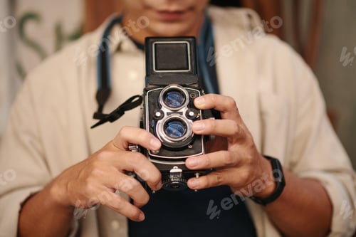 Preview: Man Taking Photos with Old Camera