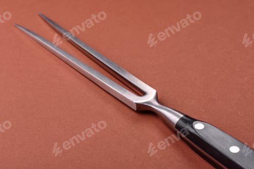 Preview: Empty meat or steak fork with vegetables, spices and other ingredients. Meat fork