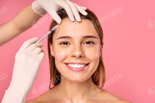 Preview: A woman is receiving a facial treatment at a salon to achieve a glowing and youthful look