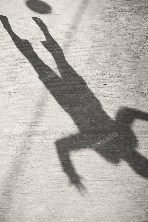 Preview: The Shadow Of A Man On The Pavement Background Image