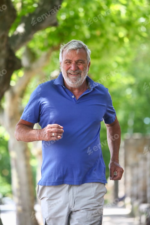 Preview: Cheerful Senior Man Jogging Outdoors