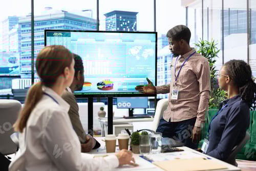 Preview: Company workers in high end office space collaborating on project management