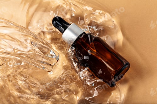 Preview: Oil cosmetic bottle on water waves background