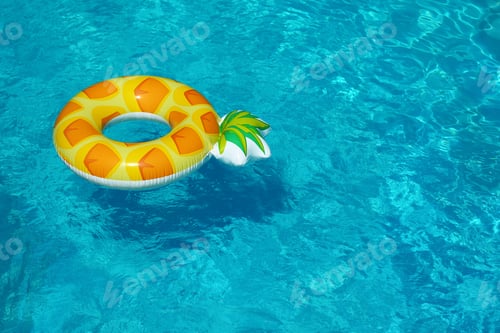 Preview: Bright inflatable pineapple ring floating in swimming pool on sunny day. Space for text