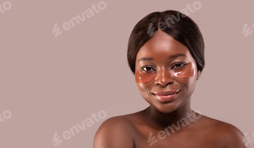 Preview: Closeup Portrait Of Beautiful African American Lady With Perfect Skin Applied Eye Patches