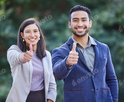 Preview: Youll always win with us. Shot of two businesspeople giving the thumbs up together.