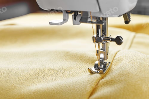 Preview: Modern Sewing Machine With Yellow Velours Fabric Close Up