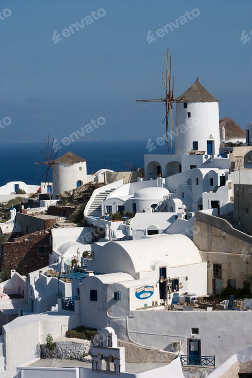 Preview: View of white washed hillside town and windmill, Oia, Santorini, Cyclades, Greece