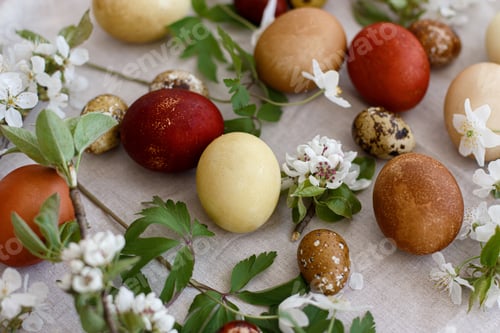 Preview: Modern red and yellow easter eggs with spring flowers on rustic linen cloth.Happy Easter! Aesthetic