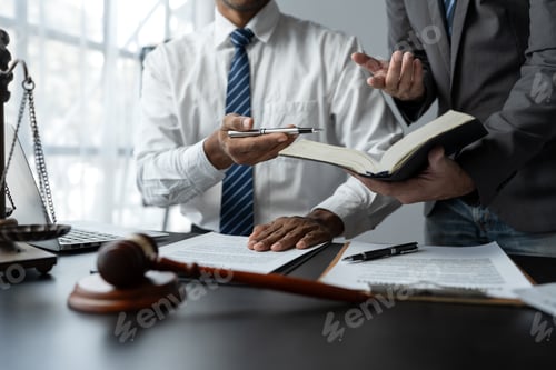Preview: Businessmen or lawyers working together at a meeting, teamwork and partnerships, discuss documents,