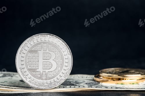 Preview: crypto currency gold bitcoins on dollar banknote background.