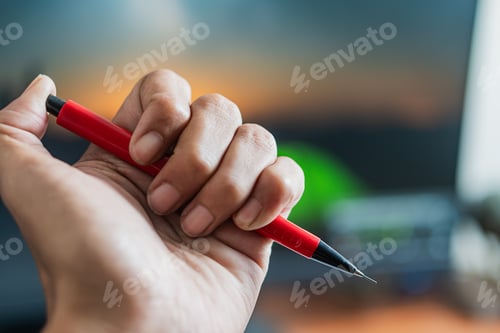 Preview: Red Pen Held in Hand