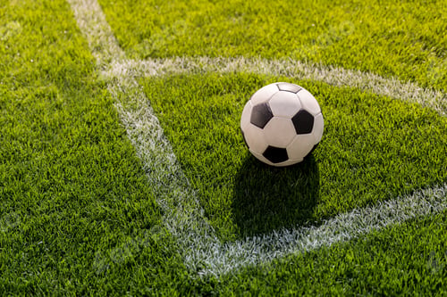 Preview: soccer ball on grass in corner kick position on soccer field stadium
