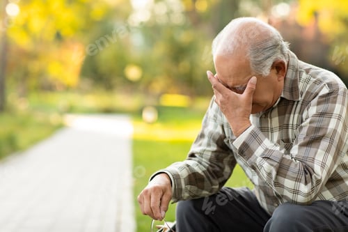 Preview: Senior Chinese man having a headache