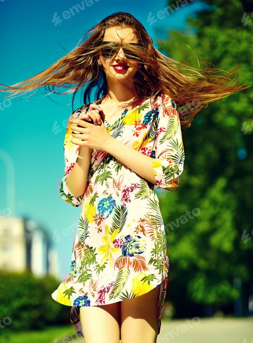 Preview: Beautiful young woman posing outdoors in summer clothes