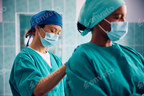 Preview: Female surgeons greeting ready for the operating room.