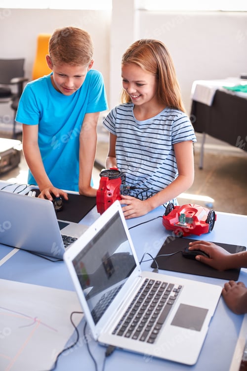 Preview: Two Students In After School Computer Coding Class Learning To Program Robot Vehicle